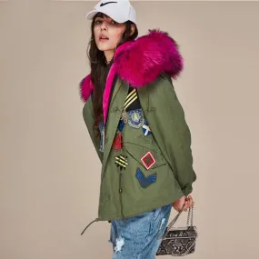 Women winter coat with embroidered badges and fur hood